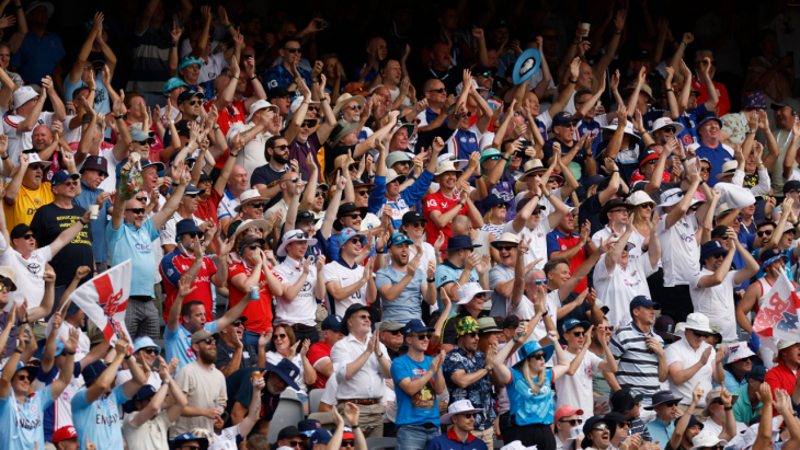 Crowds celebrate at a cricket match