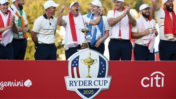 Participants of the Ryder Cup 2025 celebrate alongside the trophy